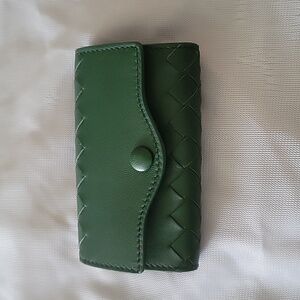Bottega Veneta key pouch in dark green.